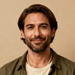 AI-generated portrait of a young man with medium-length hair and light stubble, wearing a casual jacket over a shirt, posed with an approachable expression against a warm beige background in soft light.