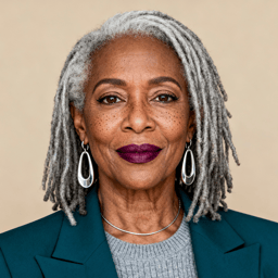 AI-generated portrait of an older woman with long gray locs and defined features, wearing a blazer and knit top, posed with a confident expression against a warm off-white background in soft studio lighting.