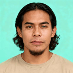 AI-generated portrait of a young man with shoulder-length hair and light facial hair, wearing a casual neutral shirt, posed with a neutral expression against a soft teal background in even studio lighting.