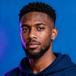 AI-generated portrait of a young man with short textured hair and a trimmed beard, wearing a hoodie, posed with a calm expression against a blue background in mixed lighting.