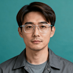 AI-generated portrait of a young man with short neatly styled hair and glasses, wearing a casual jacket over a t-shirt, posed with a neutral expression against a teal background in soft studio lighting.