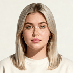 AI-generated portrait of a young woman with straight shoulder-length light hair and freckles, wearing a light crewneck top, posed with a neutral expression against a pale background in clean daylight.