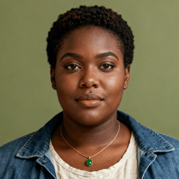 AI-generated portrait of a young woman with short natural hair, wearing a denim jacket over a light top and a simple necklace, posed with a relaxed expression against a muted green background in natural light.