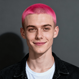 AI-generated portrait of a young person with a pink buzz cut and freckles, wearing a white shirt and dark jacket, posed with a slight smile against a gray background in cool light.