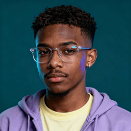 AI-generated portrait of a young man with short curly hair and glasses, wearing a hoodie over a T-shirt, posed with a neutral expression against a teal indoor background in soft light.