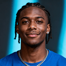 AI-generated portrait of a young man with braided hair and defined brows, wearing a blue top and chain necklace, posed with a relaxed smile against a cool-toned background in bright lighting.