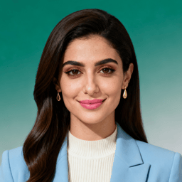 AI-generated portrait of a young woman with long straight hair, wearing a blazer over a high-neck top and small earrings, posed with a gentle smile against a teal studio background in soft even light.
