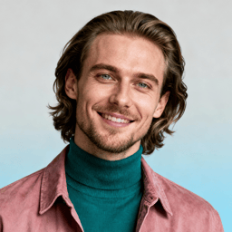 AI-generated portrait of a young man with shoulder-length wavy hair and light facial hair, wearing a turtleneck under a casual jacket, posed with a warm smile against a soft blue studio background in even light.