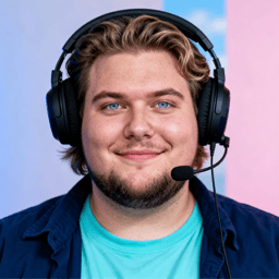 AI-generated portrait of a young man with medium-length hair and light facial hair, wearing a T-shirt and over-ear headset, posed with a relaxed smile against a colorful LED-lit background.