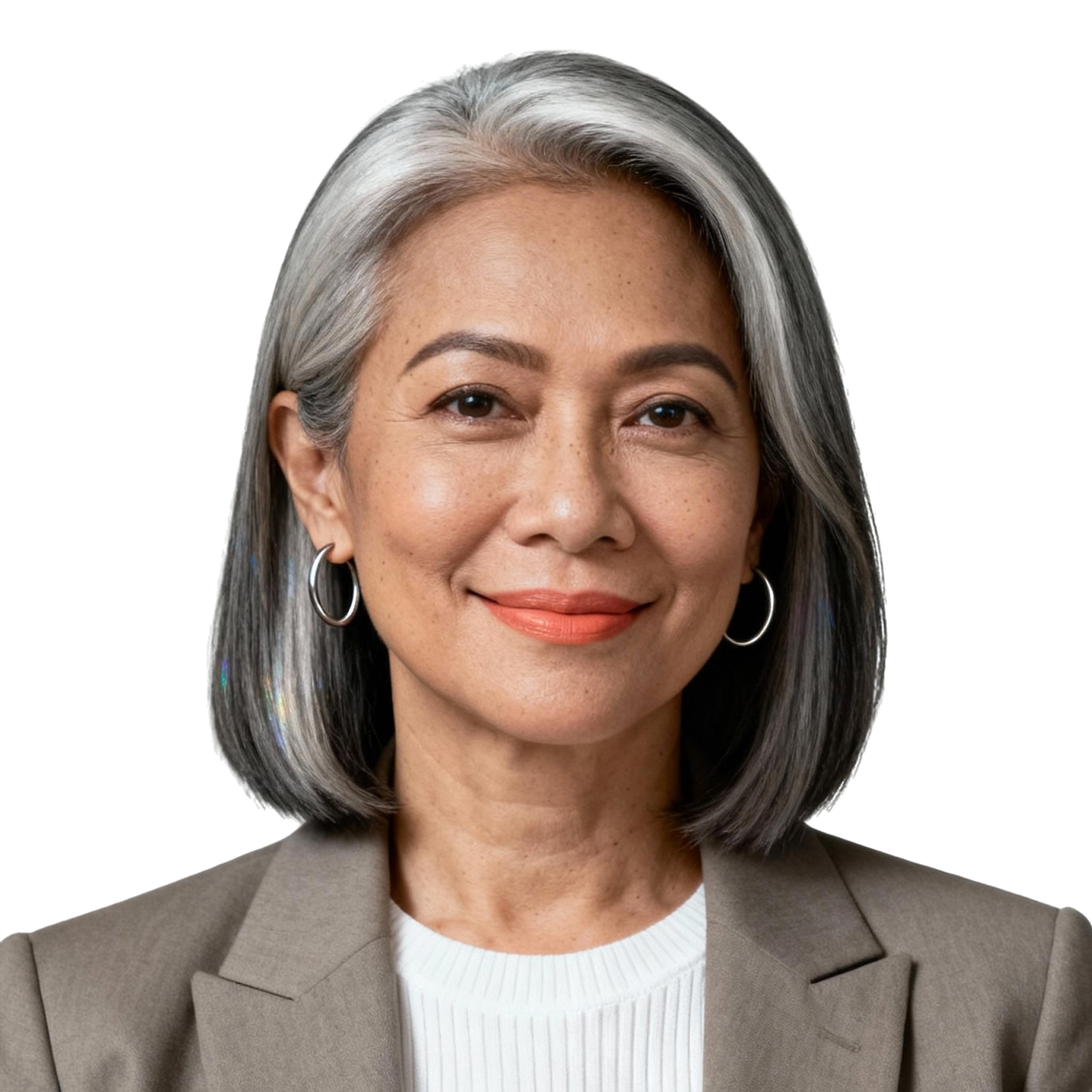 AI-generated portrait of an older woman with a sleek gray bob and defined features, wearing a blazer over a light top, posed with a gentle smile against a transparent background in diffused studio lighting.