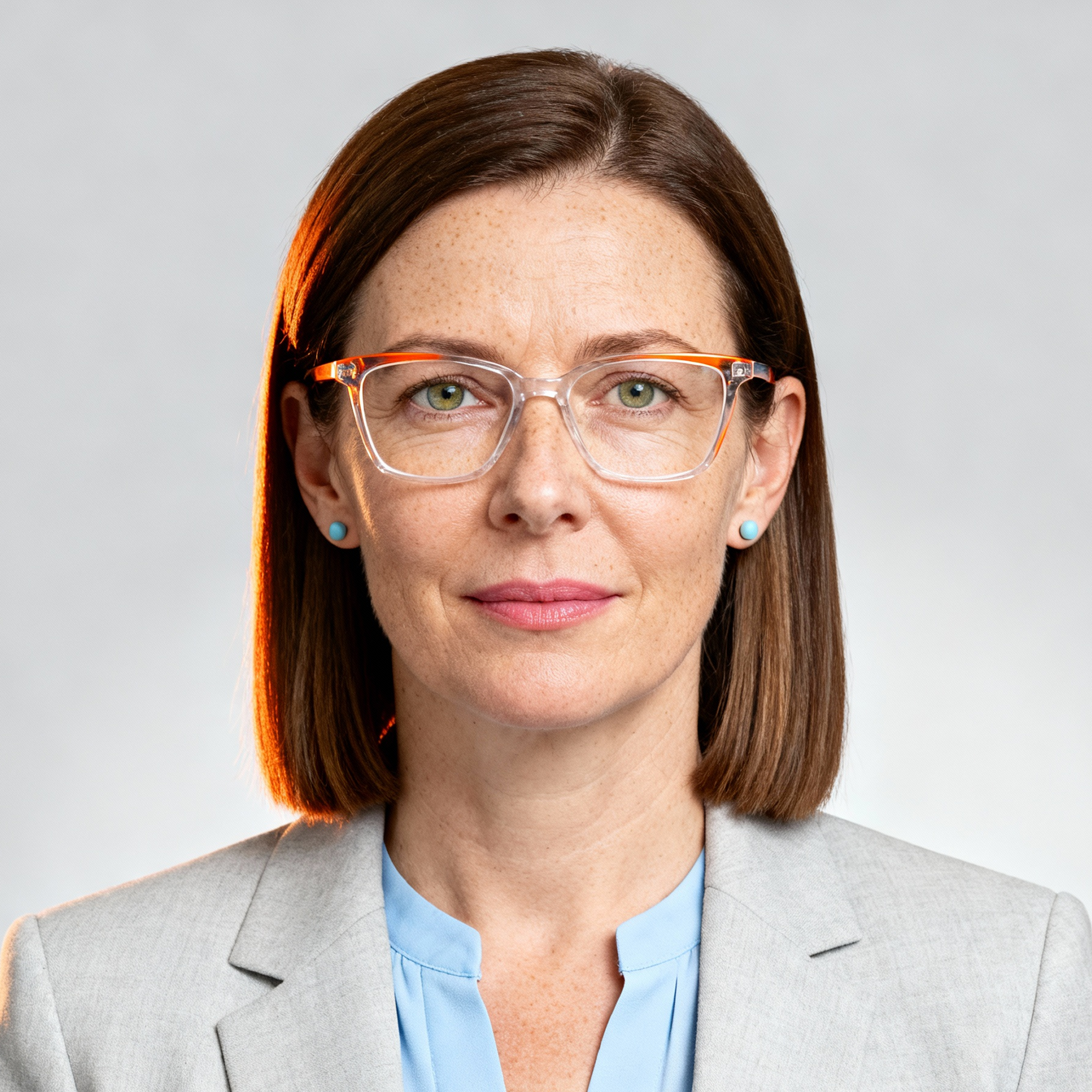 AI-generated portrait of a middle-aged woman with straight shoulder-length hair and glasses, wearing a blazer and blouse, posed with a neutral expression against a light gray background in diffused light.
