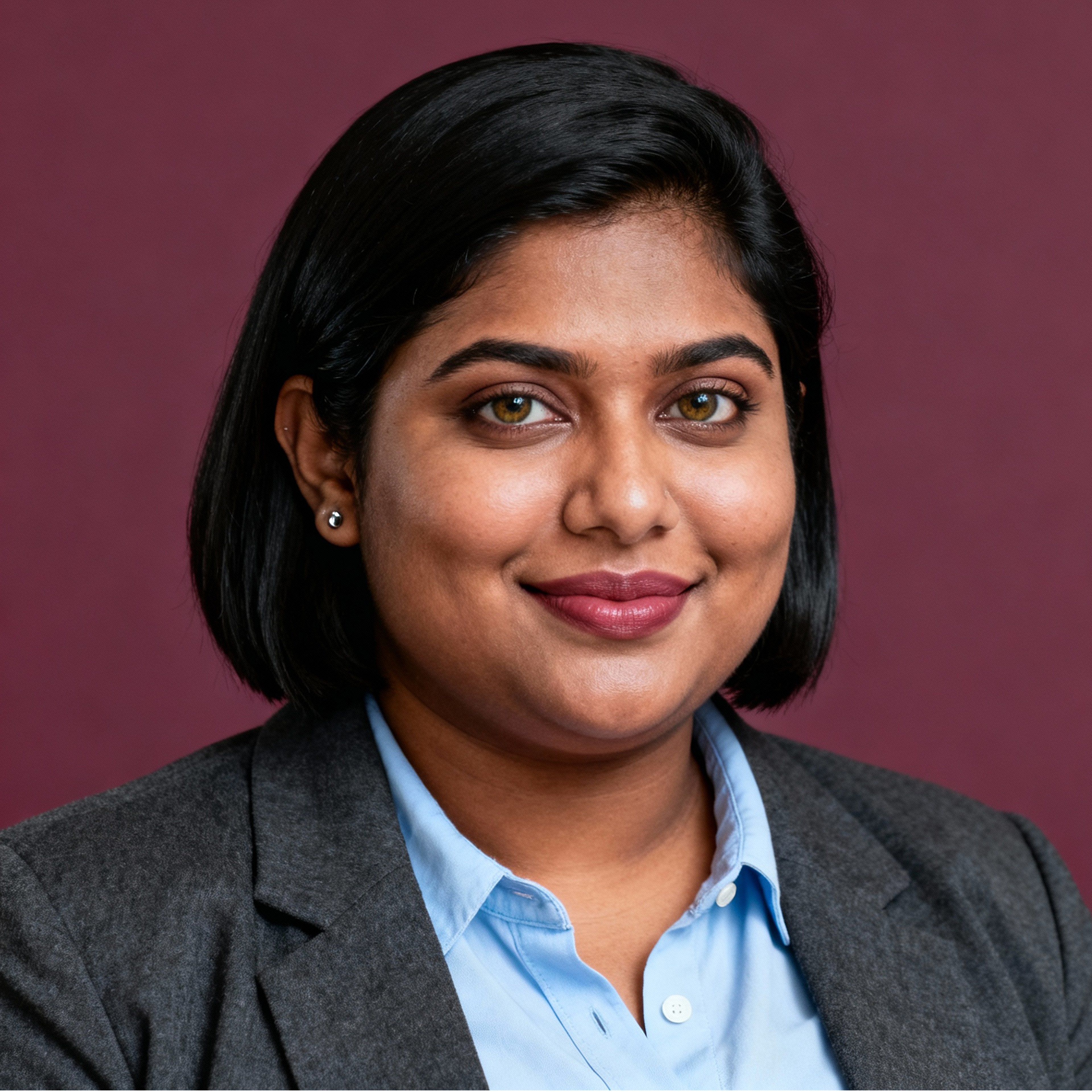 AI-generated portrait of a young woman with shoulder-length dark hair, wearing a blazer and collared shirt, posed with a warm expression against a deep maroon background in soft lighting.