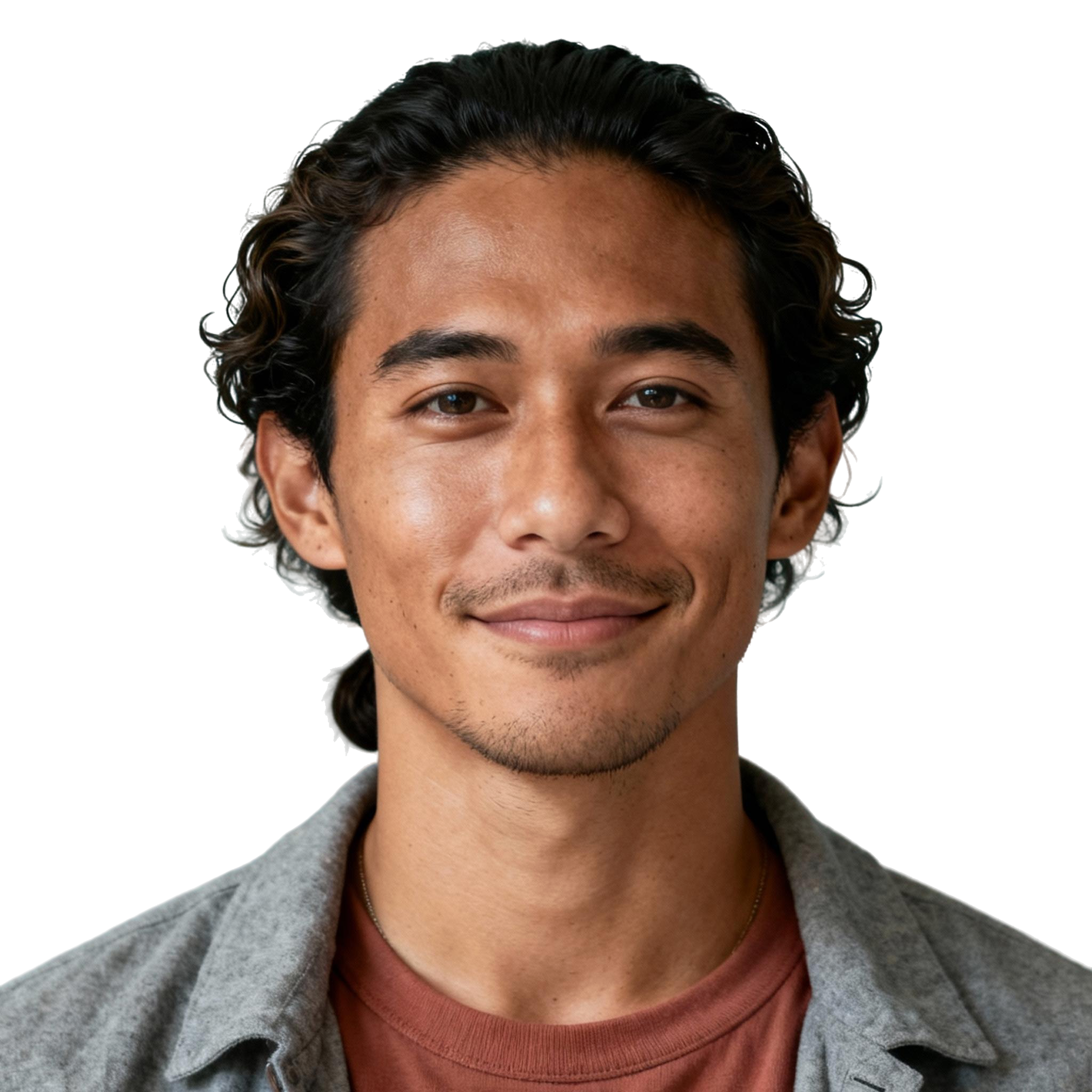 AI-generated portrait of a young man with wavy hair pulled back and light facial hair, wearing a casual jacket over a t-shirt, posed with a gentle smile against a transparent background in soft diffused light.