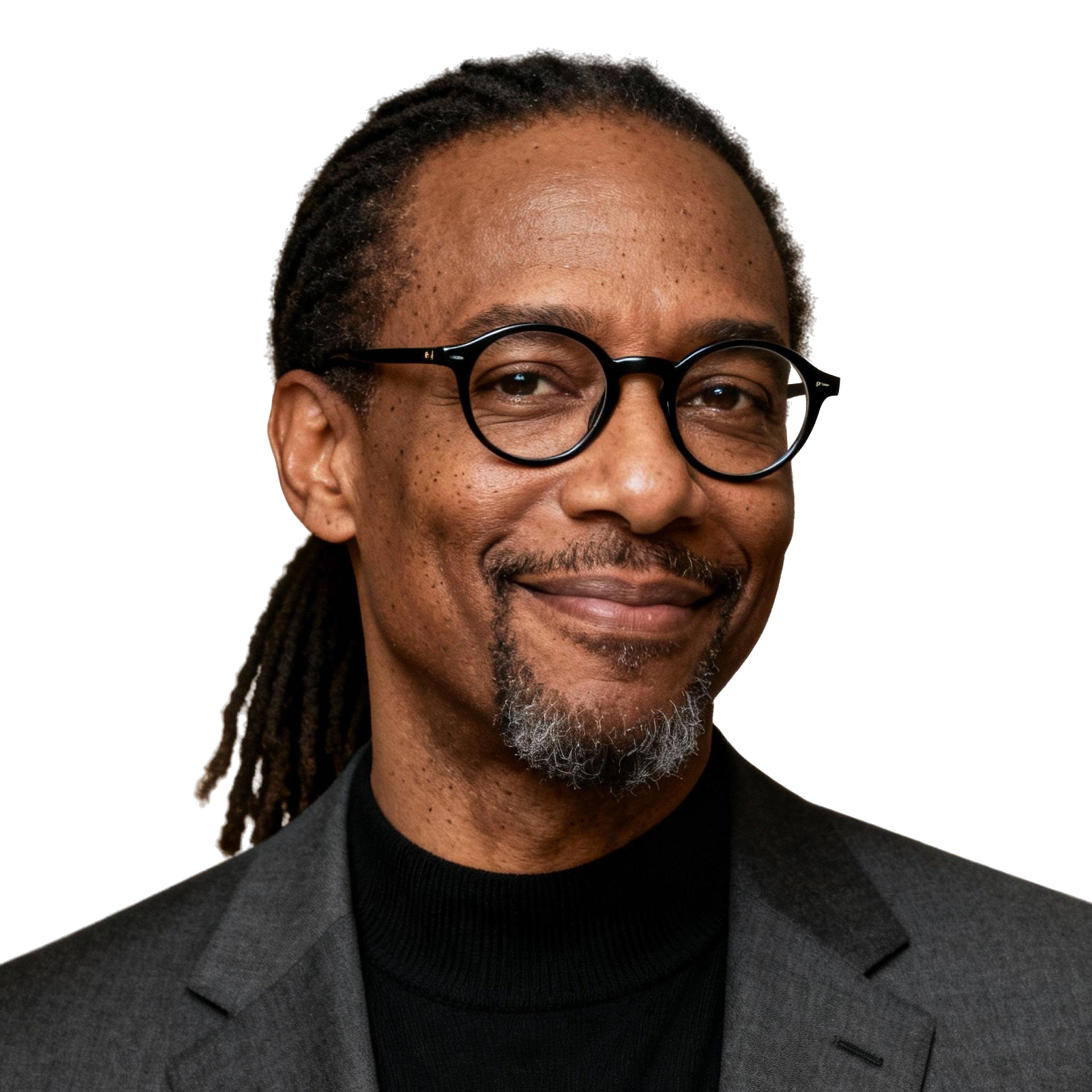 AI-generated portrait of a middle-aged man with long locs pulled back, round glasses, and a short goatee, wearing a blazer over a dark top, posed with a gentle smile against a transparent background in clean studio lighting.