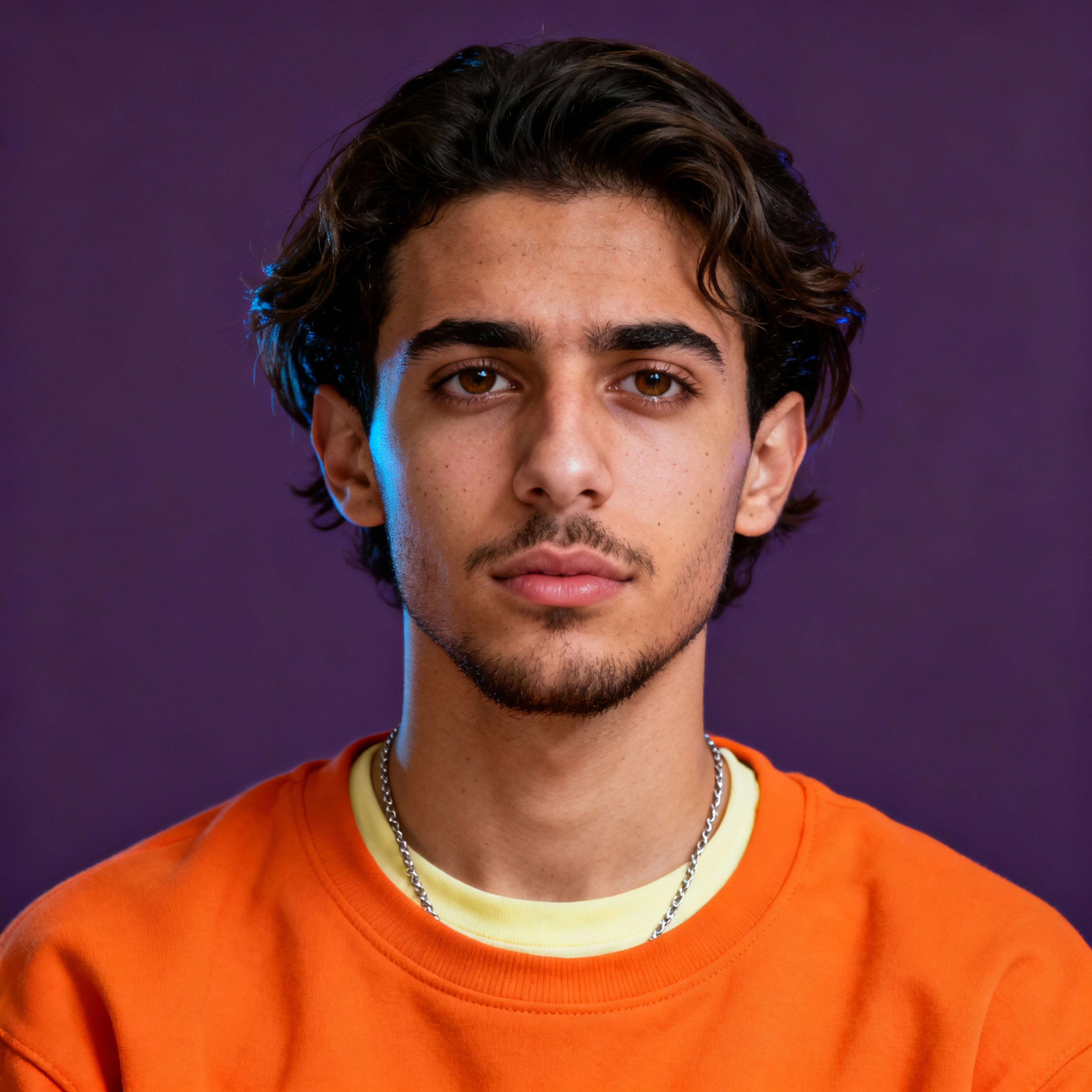AI-generated portrait of a young man with medium-length hair and light facial hair, wearing a sweatshirt and chain necklace, posed with a neutral expression against a purple studio background in soft light.